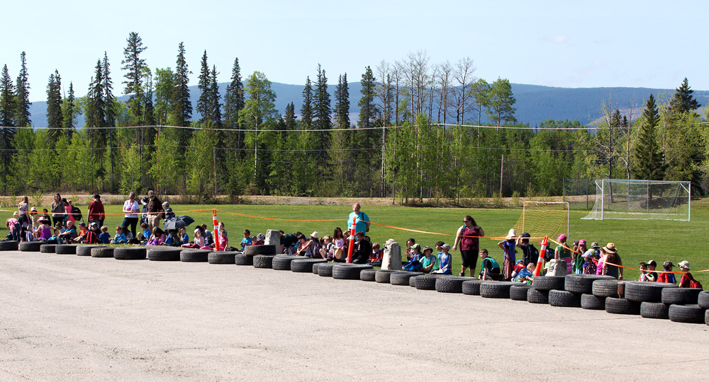 Group of people watching a go-kart race