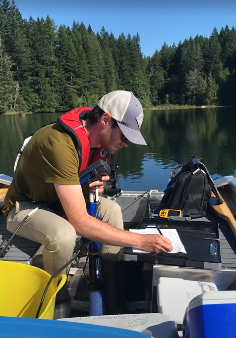 Lake volunteer filling out a form.