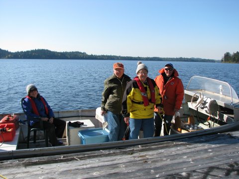 Summit Lake volunteers on a boat in 2011