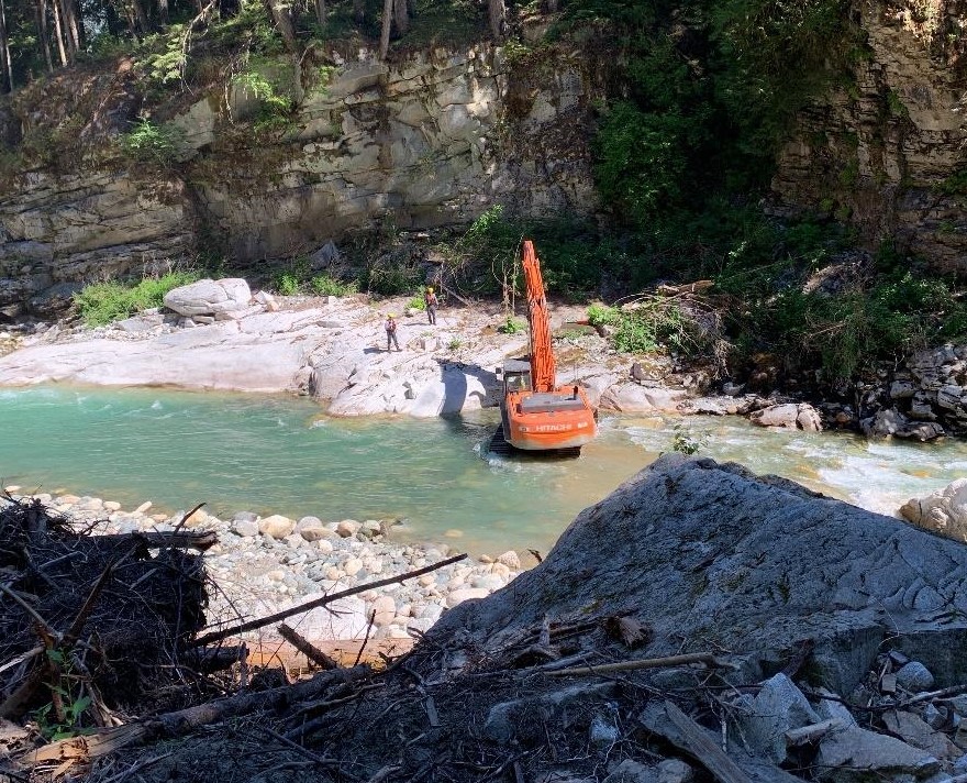 An excavator removes debris at the Othello Tunnels