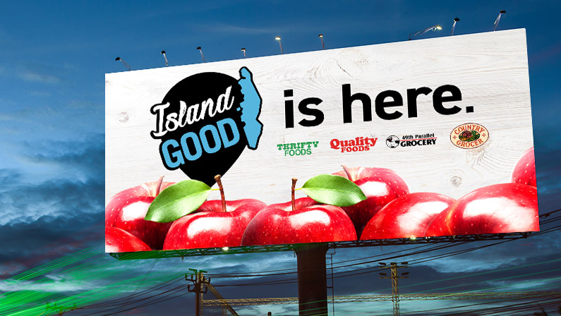 Island Good billboard with logo, featuring apples