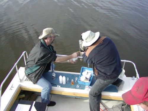 Volunteers collecting water samples on Chief Lake for a Level 3 study.