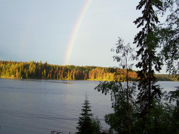 A rainbow over a lake