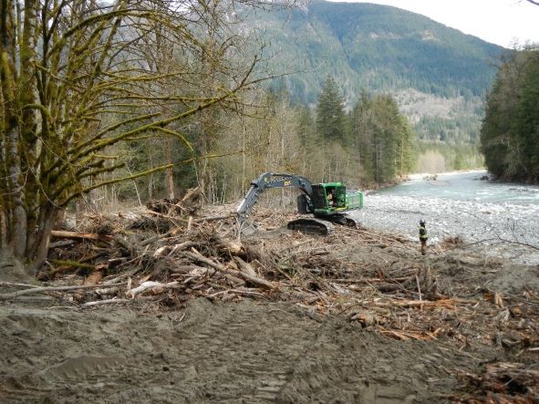 Excavator removes woody debris from the entrance to Othello Tunnels
