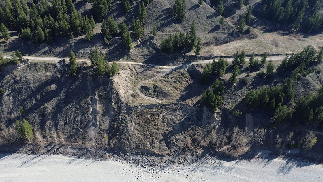 Aerial view of Soda Creek-MacAlister Road along the Fraser River. Seen here is the initial slide damage that occurred in 2020. April 18, 2024
