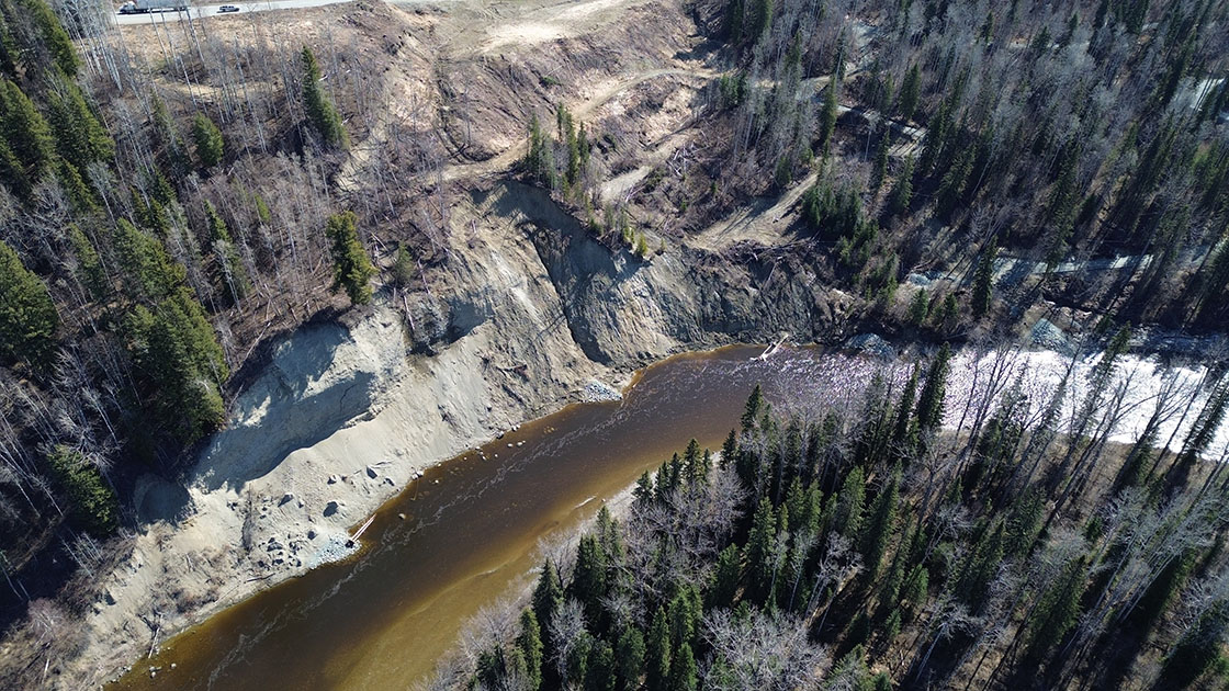 An aerial photo of slide impacts along the riverbank at Highway 97 at Cottonwood Hill. April 17, 2024