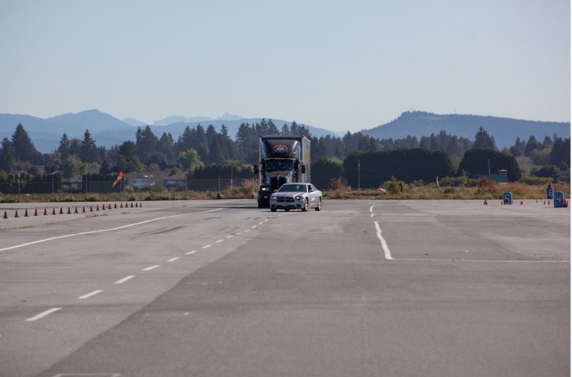  Picture demonstrating a car darting in front of a commercial truck