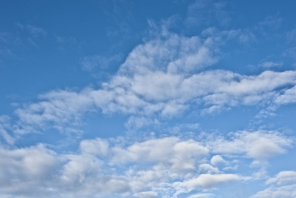 Image of white clouds on a blue sky.