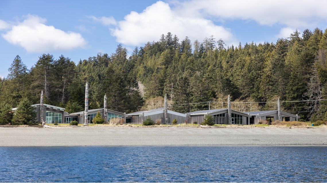Haida Gwaii beach and buildings with phone lines in background