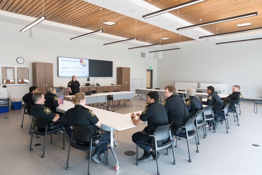 An image of a group of correctional officers in a classroom