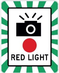 Red light camera warning sign.