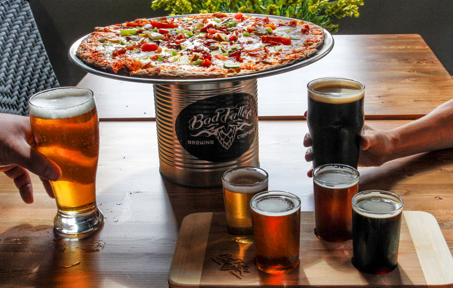 Close up of pizza and beer in a restaurant