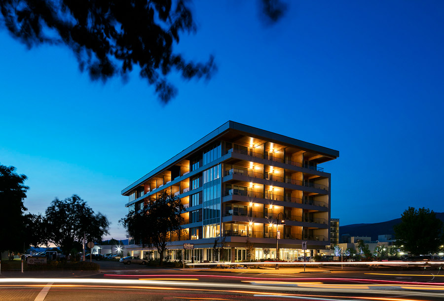 Lakeside hotel lit up at nighttime