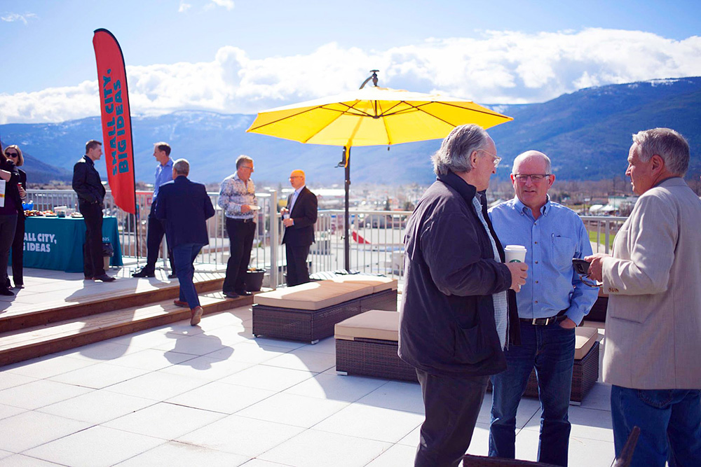 Sunny rooftop patio with a view of the mountains