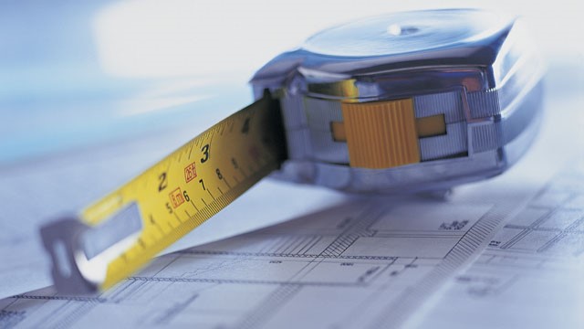 An extended measuring tape on paper