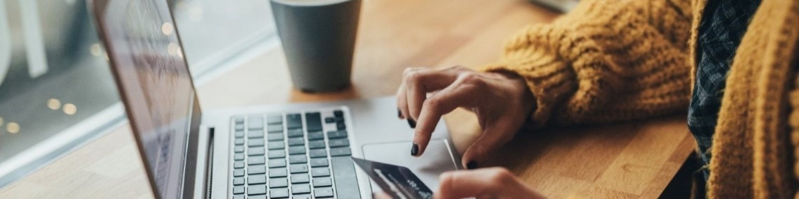 Person making online purchase on a laptop