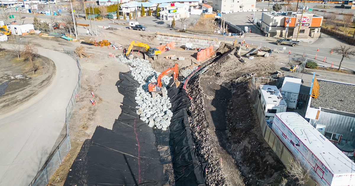 The existing culvert under Highway 97 was insufficient for handling peak river flows and debris, especially during the spring freshet. It was replaced with a 13-meter-long, four-lane bridge designed to accommodate increased water flows due to climate change and ensure structural stability against future erosion.