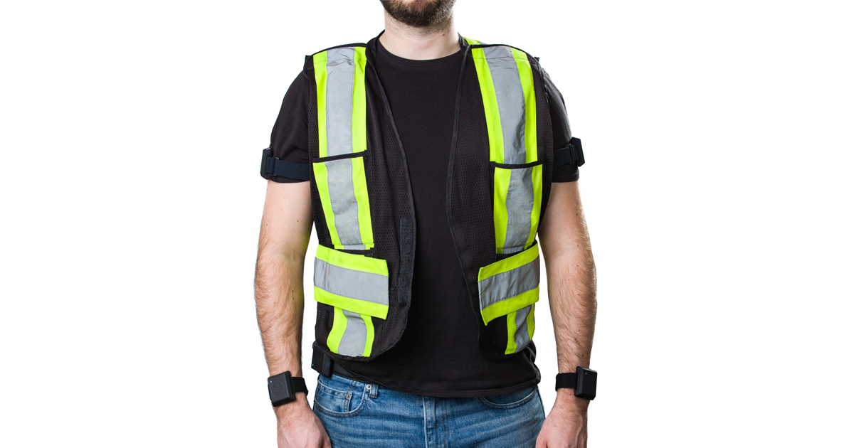 A man in a safety vest with a wearable technology