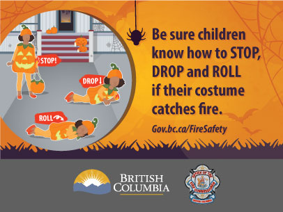 Image of a little girl dressed up for Halloween practising how to stop, drop and roll in case her costume catches fire