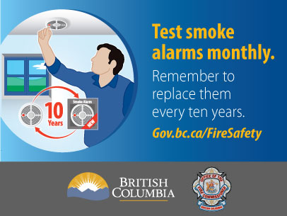 image of a man testing a smoke alarm