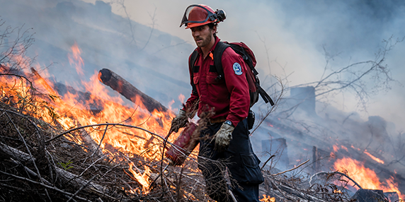 BC Wildfire Service firefighter conducts a planned ignition