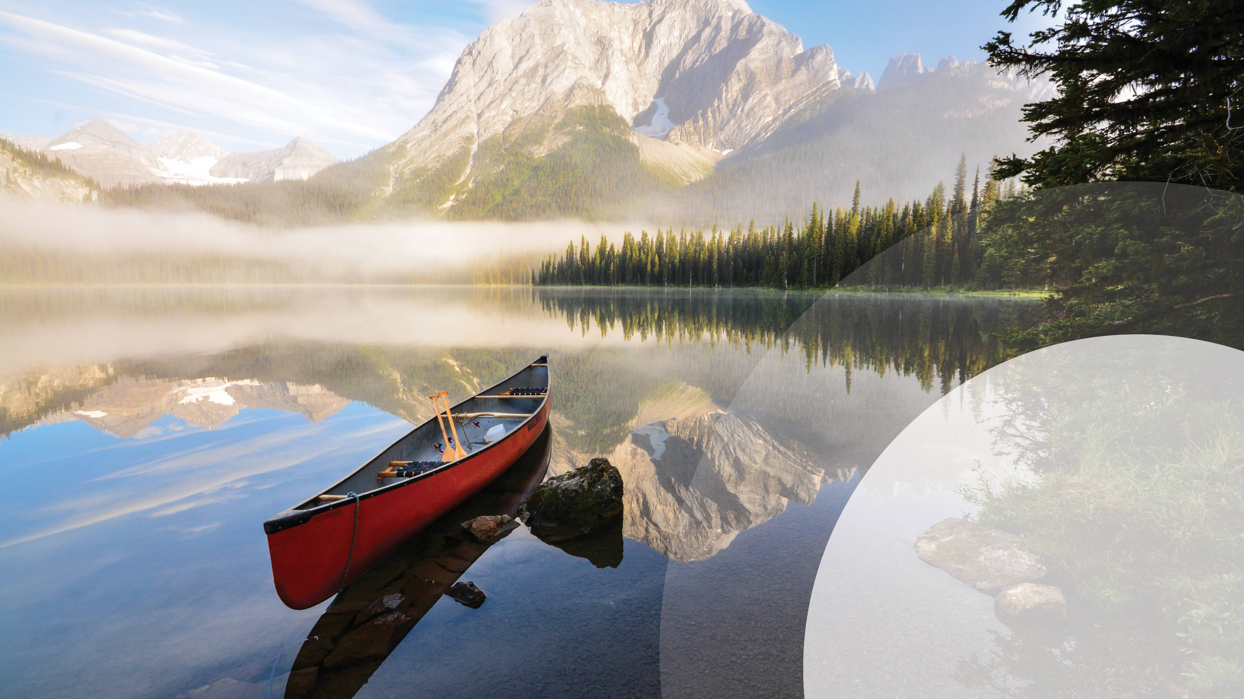 Canoe floating on a tranquil lake