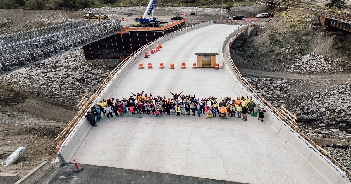 people standing on Nicomen River Bridge