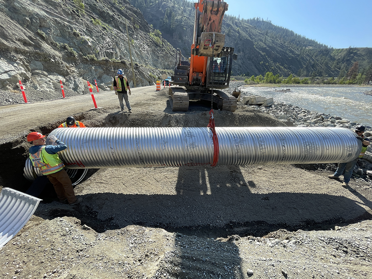 Crew installing larger culverts to improve drainage at site 18 Crew installing larger culverts to improve drainage at site 18