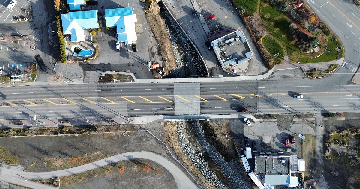 an aerial photo of a completed bridge over cache creek