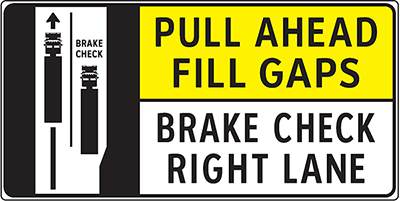 Highway sign showing two trucks on a road with one of them in a pull off lane - PULL AHEAD FILL GAPS - BRAKE CHECK RIGHT LANE Highway sign showing two trucks on a road with one of them in a pull off lane - PULL AHEAD FILL GAPS - BRAKE CHECK RIGHT LANE